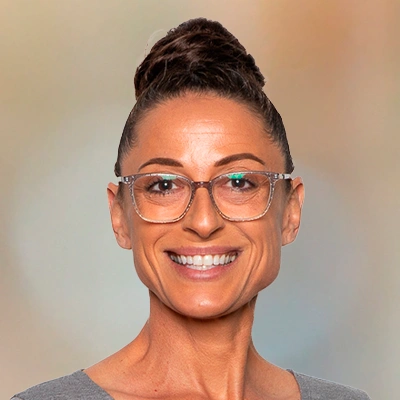 Professional headshot of a person wearing glasses